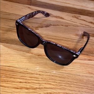 black sunglasses with snake skin detailing